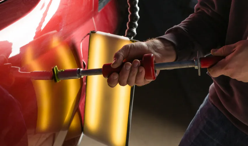 PDR Technician removing dents